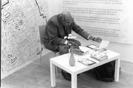 Stephen Willats: Changing Everything, Participant manning the information desk in the South London Gallery